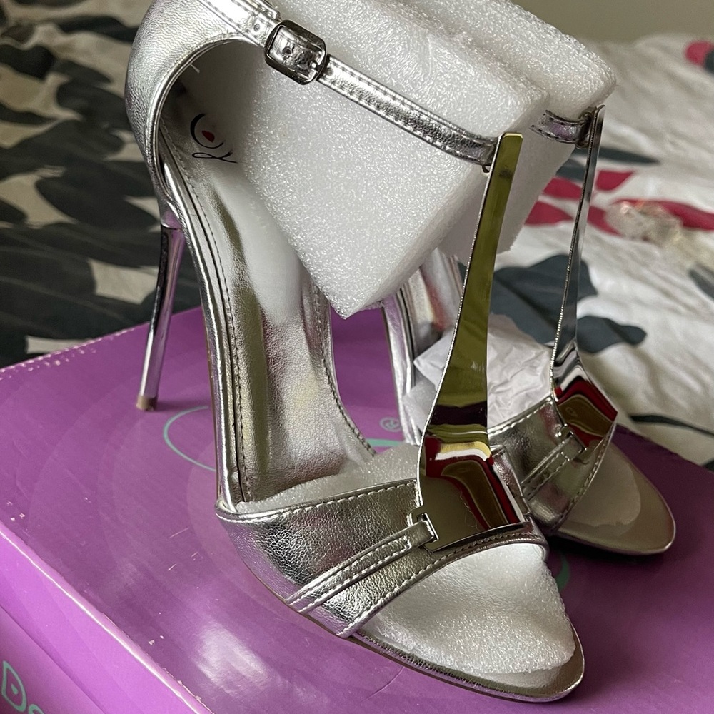 New silver stilettos, size 7